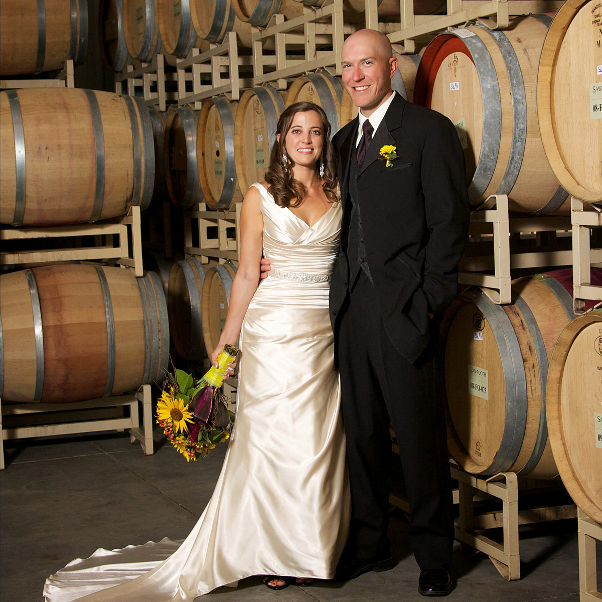 wedding photo in winery barrell room