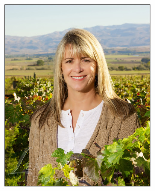 Ilene Standing amognst the grape vines