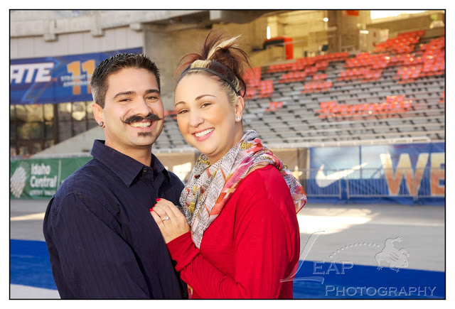Engagement portrait on the BSU blue turf