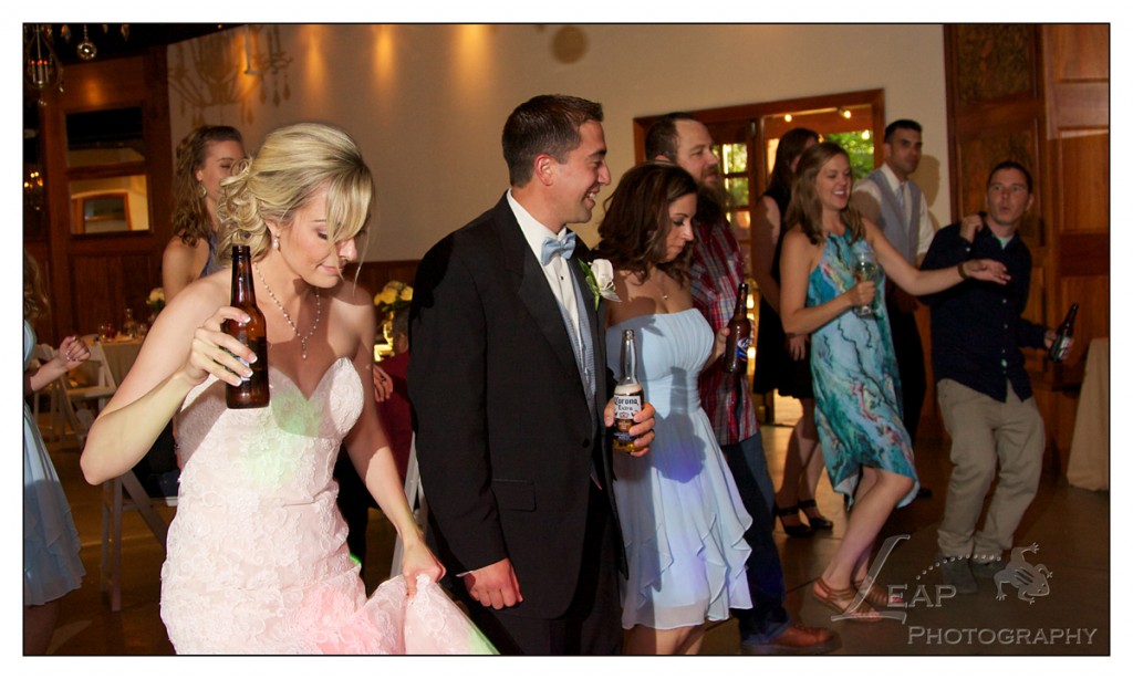 bride and groom dancing with guests