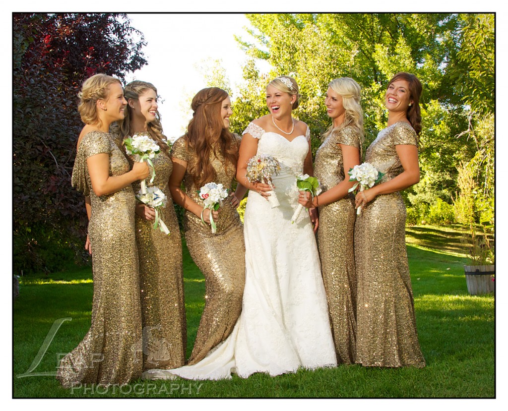 laughing bridesmaids in gold sparke dresses