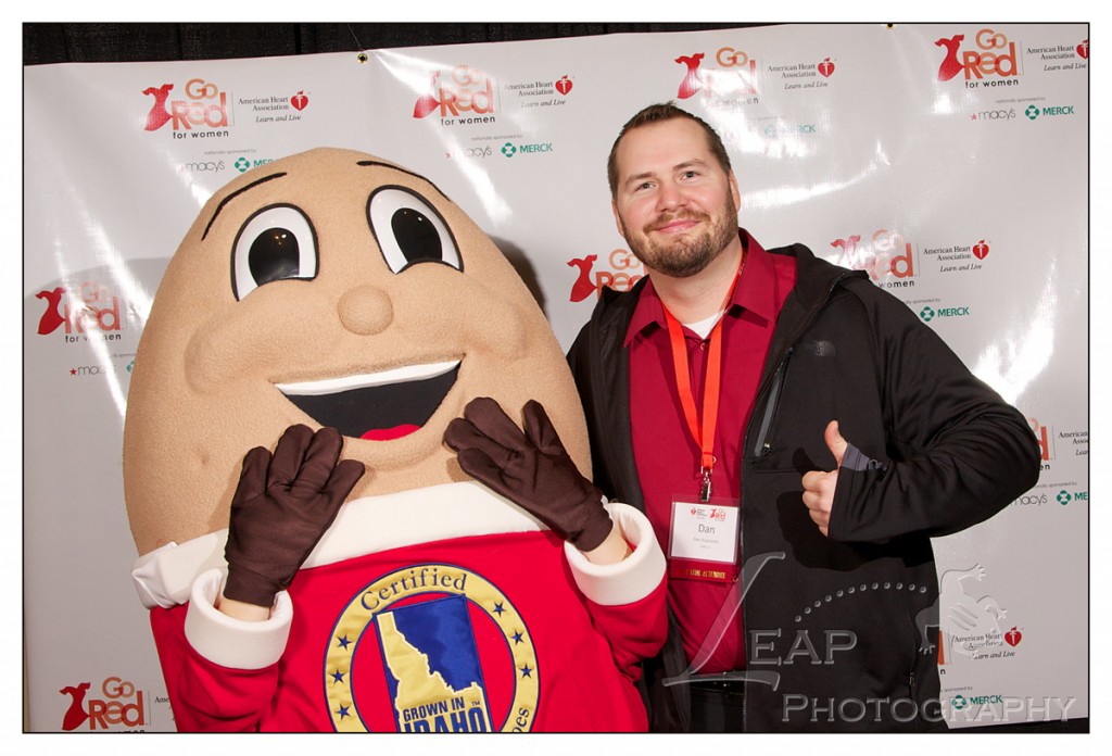 Spuddy Buddy poses with man at Boise Go Red For Women luncheon