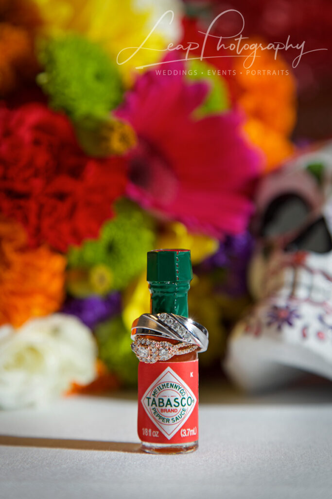 wedding rings on a tabasco sauce jar