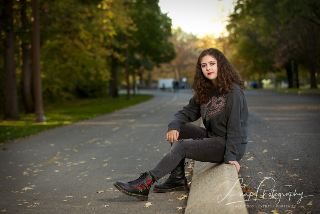 senior photo of female wearing dr. martens on the Boise Greenbelt