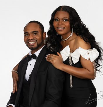 Studio portrait of a couple that features a crisp white background and professional lighting