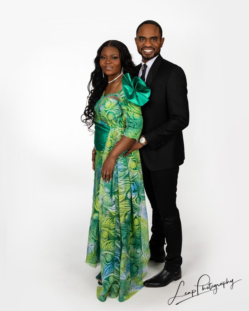 Couple wearing formal wear and photographed on a crisp white background in the Leap Photography studio