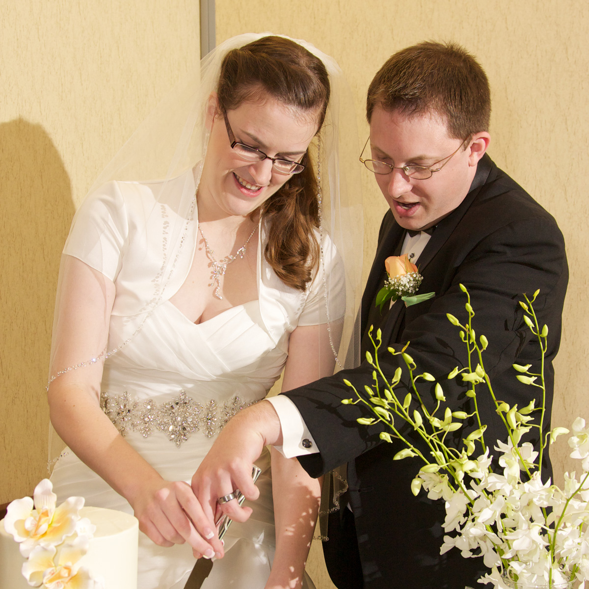 couple cutting wedding cake